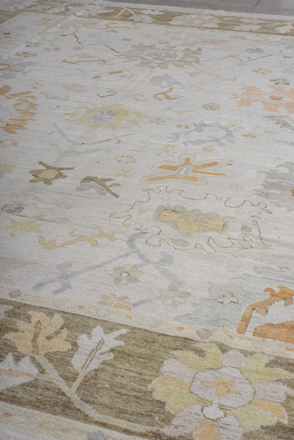 11' x 14' one-of-a-kind handmade vintage Oushak oversize rug. Color palette: ivory, taupe, sage, camel, pale gold
