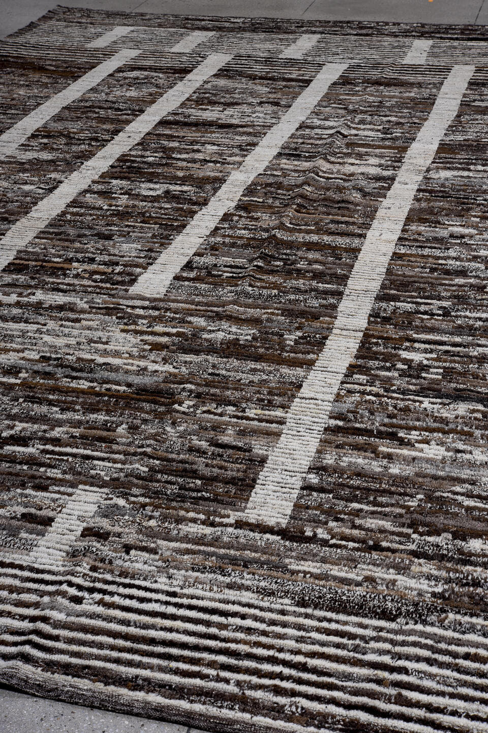 13' x 16' one-of-a-kind handmade vintage Tulu oversize rug. Color palette: charcoal, ivory, taupe, brown, slate, gray, black
