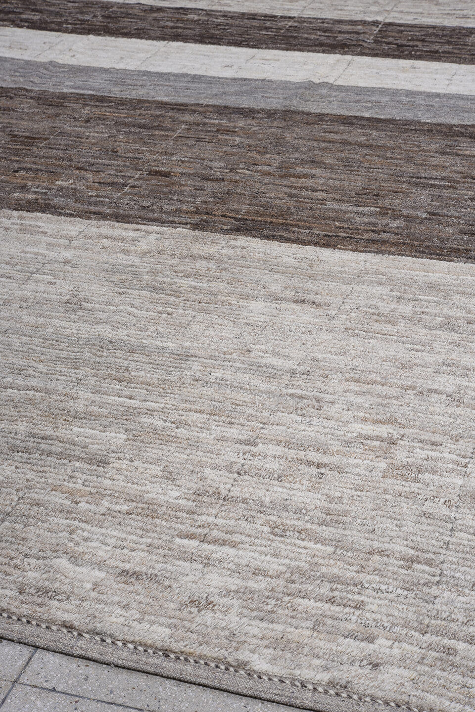 13' x 14' one-of-a-kind handmade vintage Tulu oversize rug. Color palette: ivory, charcoal, taupe, gray, brown, black, beige