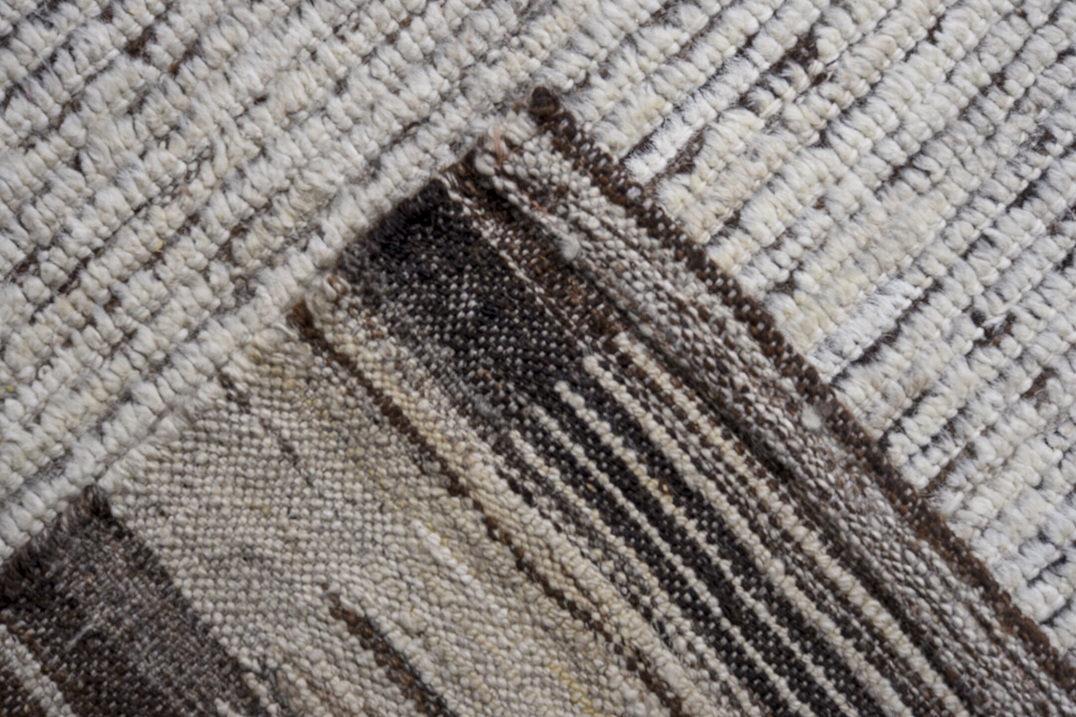 13' x 16' one-of-a-kind handmade vintage Tulu oversize rug. Color palette: ivory, charcoal, taupe, brown, gray, black, beige