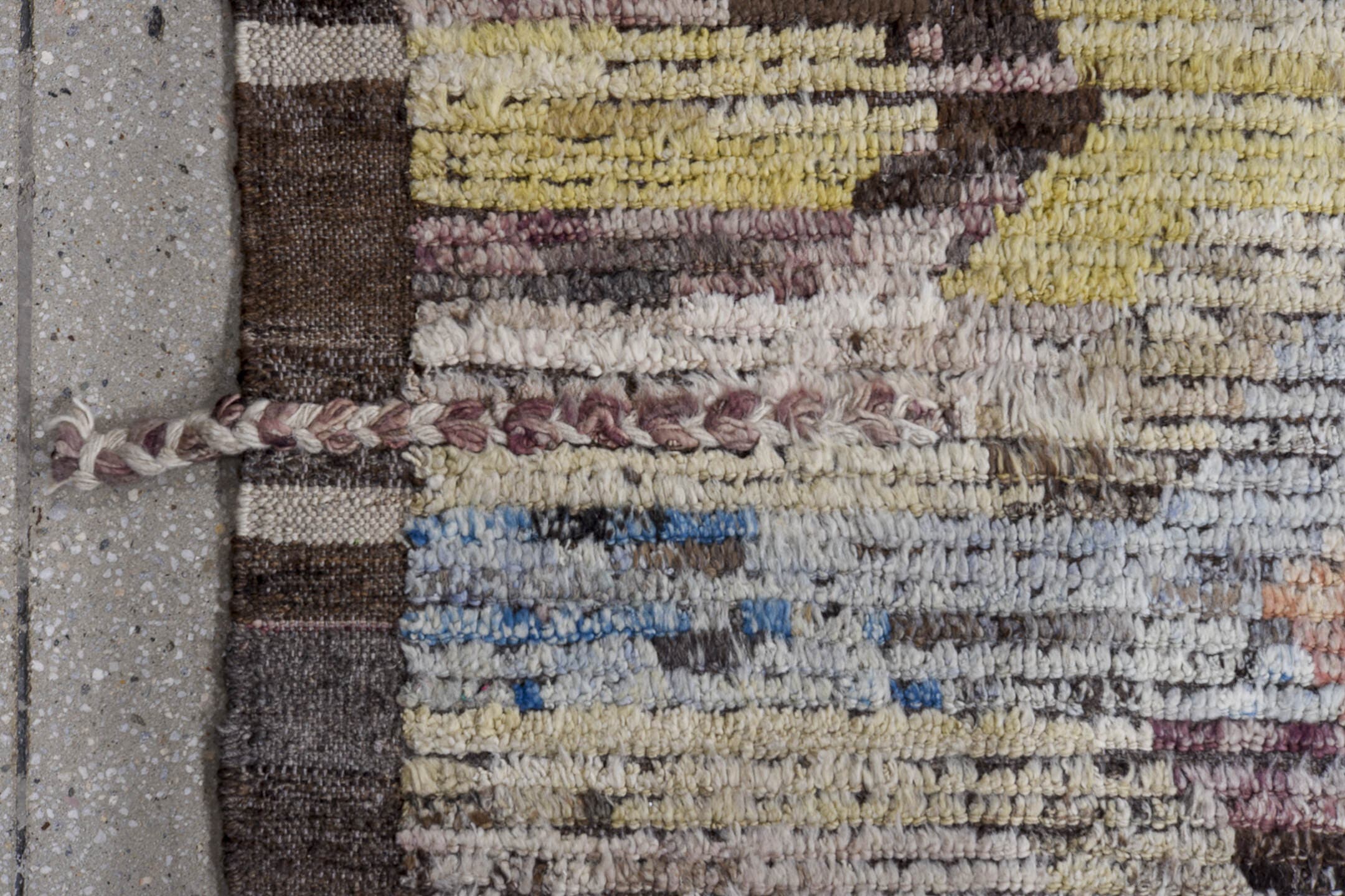 9' x 12' one-of-a-kind handmade vintage Tulu large size rug. Color palette: ivory, gray, charcoal, raspberry, sky blue