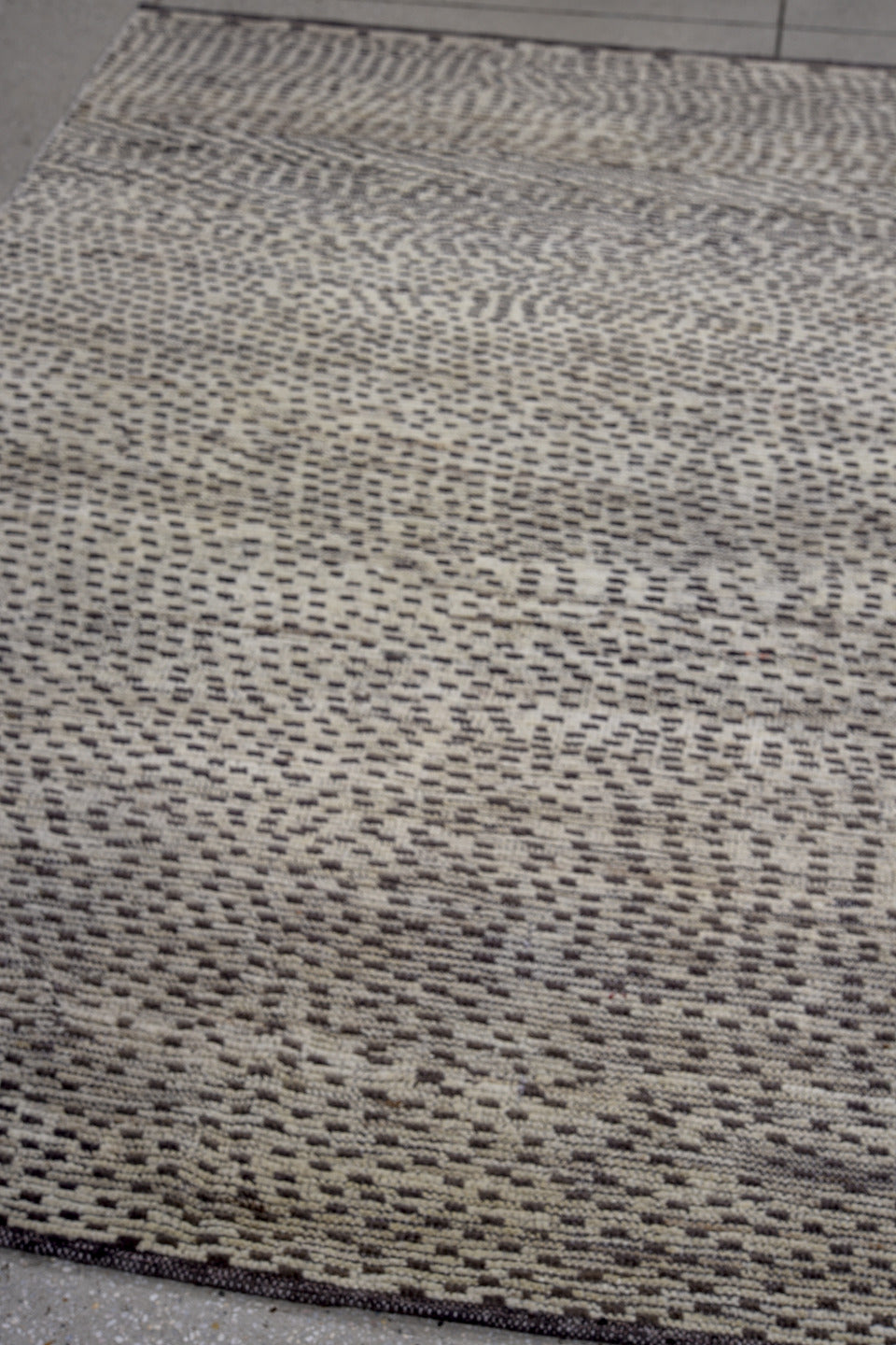 4' x 7' one-of-a-kind handmade vintage Tulu rug. Color palette: ivory, charcoal, gray, black