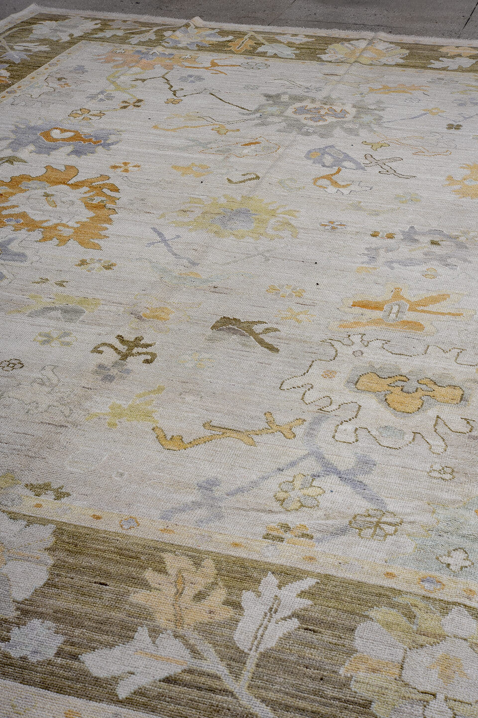 11' x 14' one-of-a-kind handmade vintage Oushak oversize rug. Color palette: ivory, taupe, olive, pale blue, gold, cream