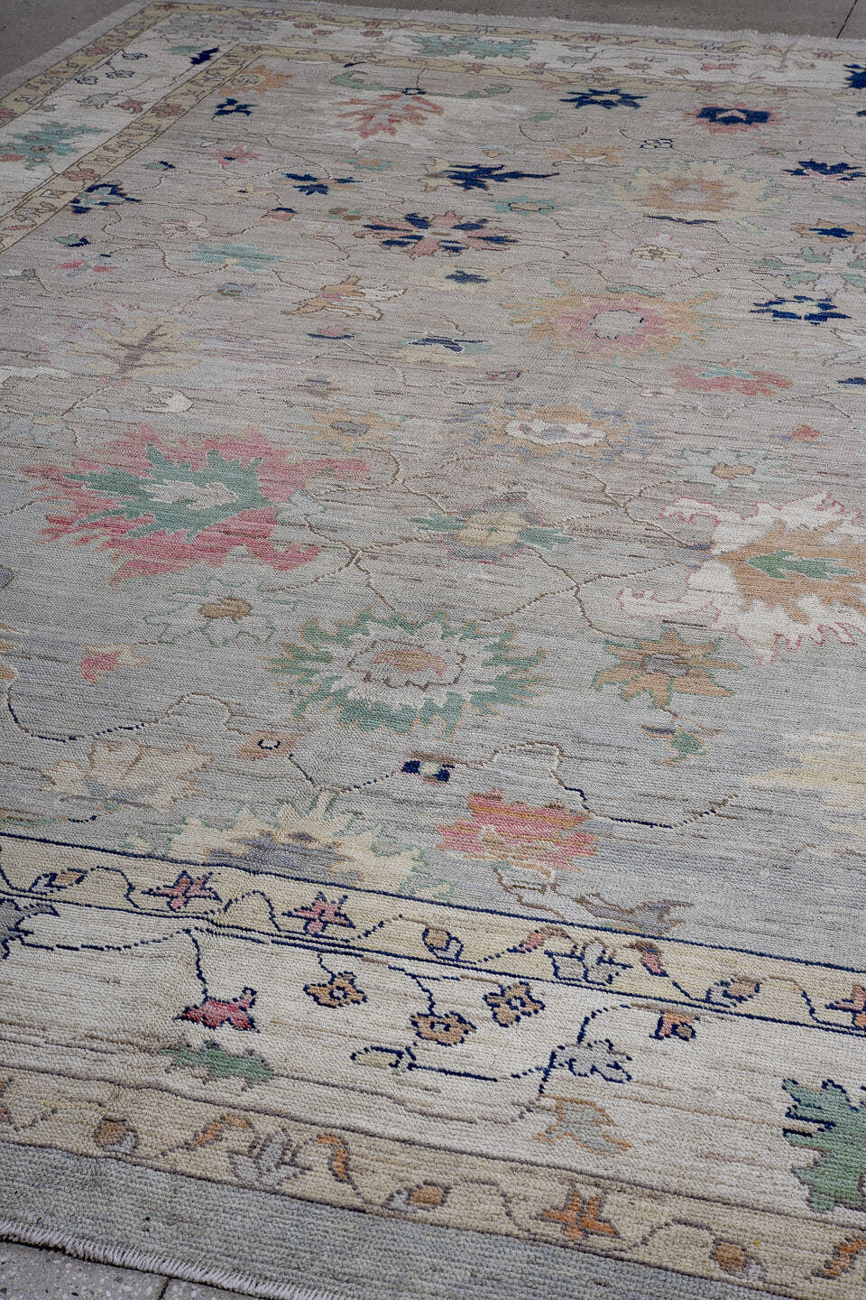 11' x 15' one-of-a-kind handmade vintage Oushak oversize rug. Color palette: ivory, taupe, sage, aqua, blush, navy, gold