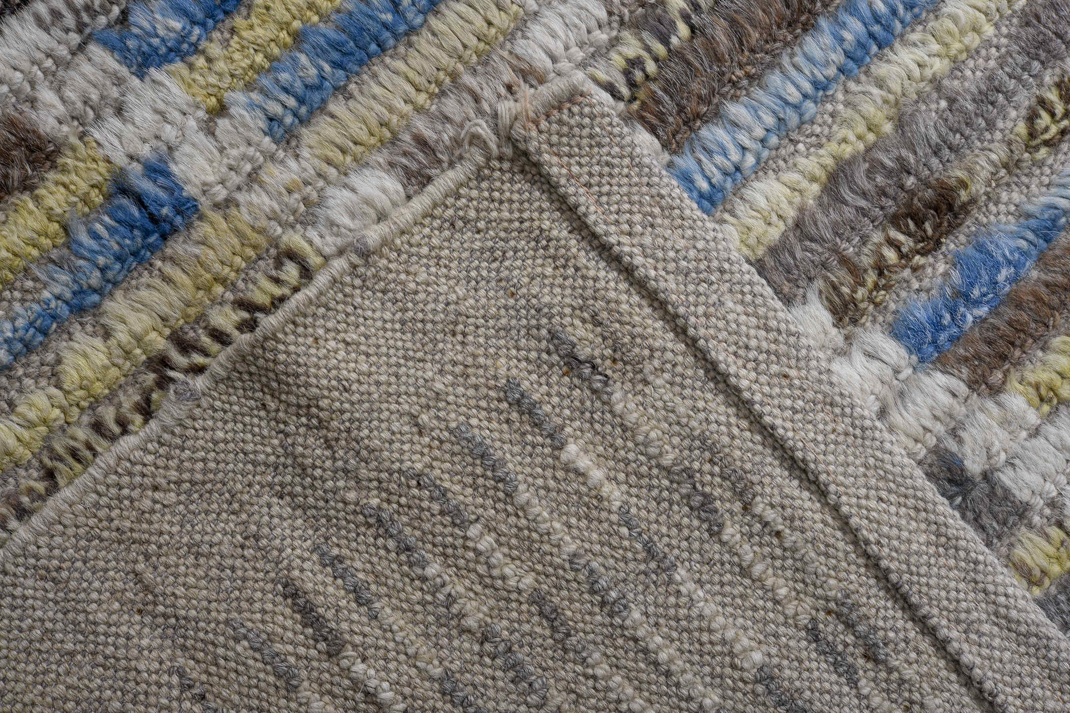 13' x 15' one-of-a-kind handmade vintage Tulu oversize rug. Color palette: ivory, gray, blue, charcoal, taupe, gold, sage