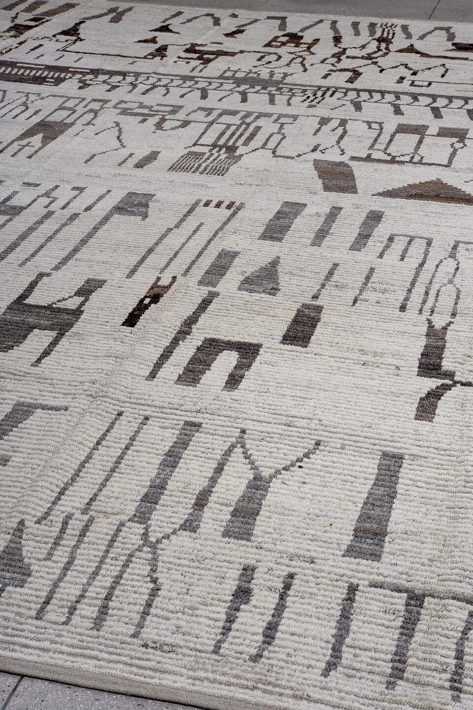 13' x 16' one-of-a-kind handmade vintage Tulu oversize rug. Color palette: ivory, charcoal, taupe, slate, gray, black, beige