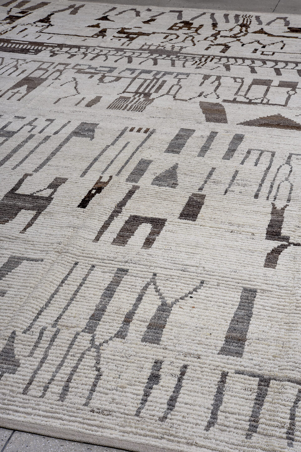 13' x 16' one-of-a-kind handmade vintage Tulu oversize rug. Color palette: ivory, charcoal, taupe, slate, gray, black, beige