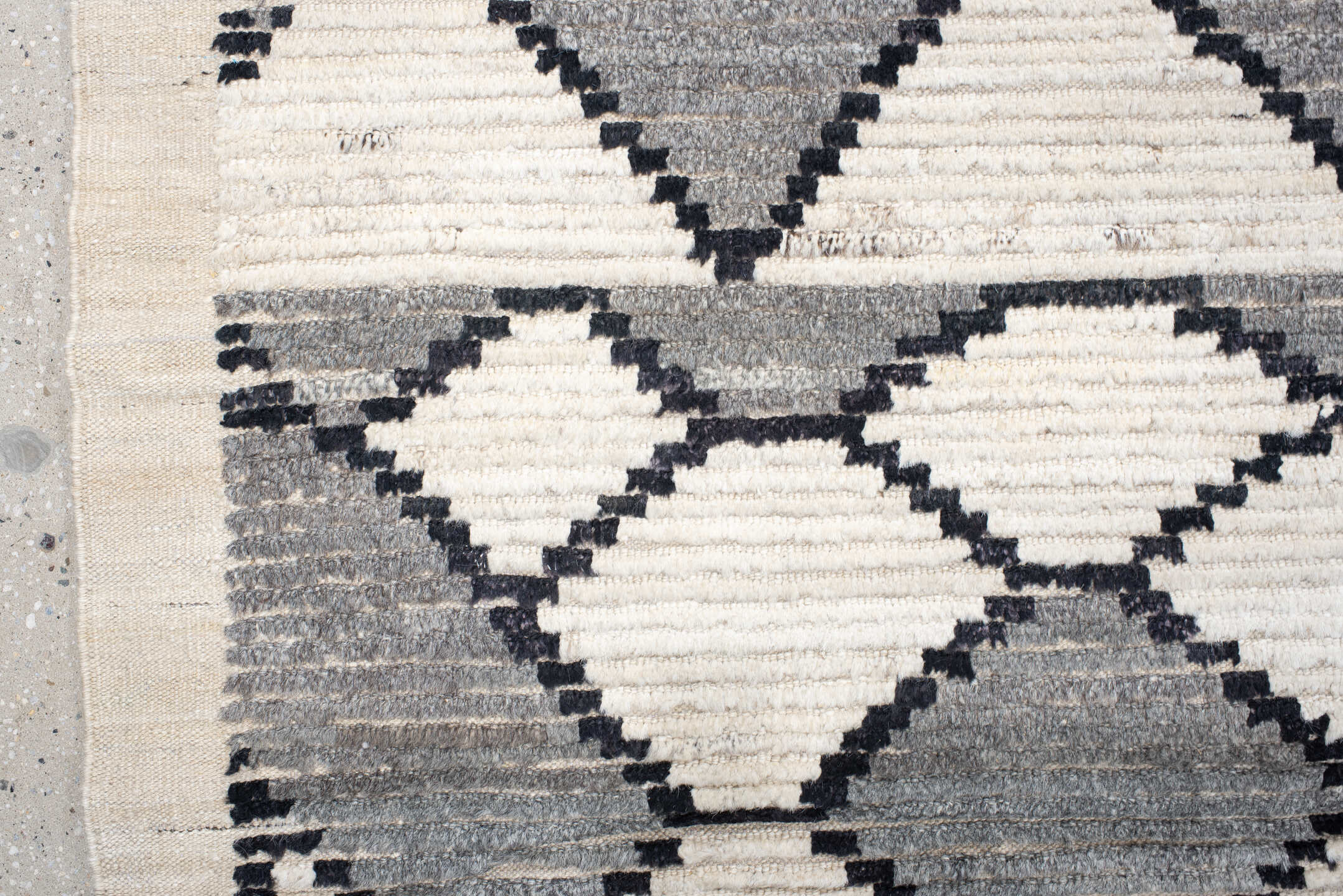 13' x 17' one-of-a-kind handmade vintage Tulu oversize rug. Color palette: ivory, charcoal, gray, black