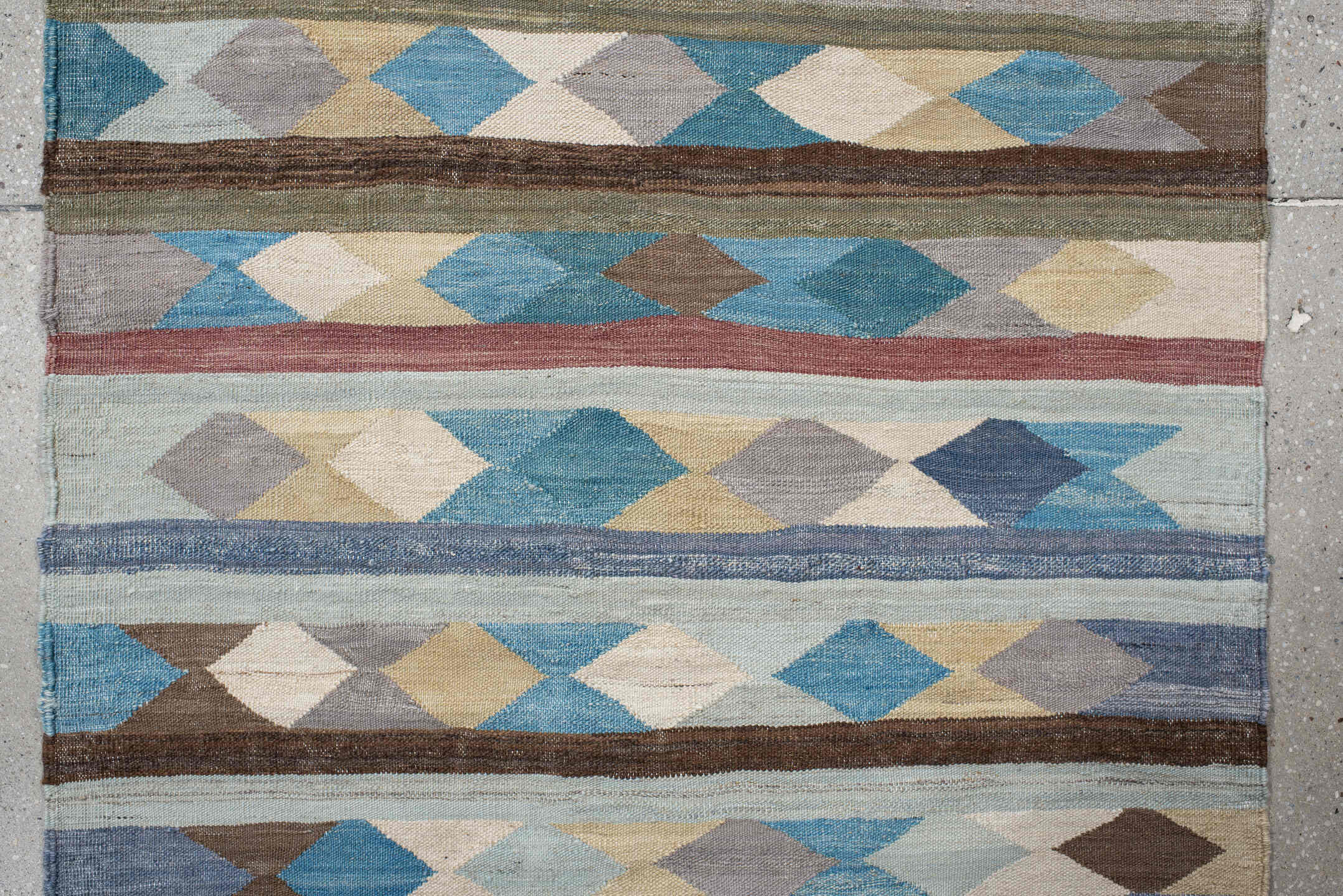 2' x 9' one-of-a-kind handmade vintage Kilim runner rug. Color palette: gray, brown, red, light blue, light gray, pink