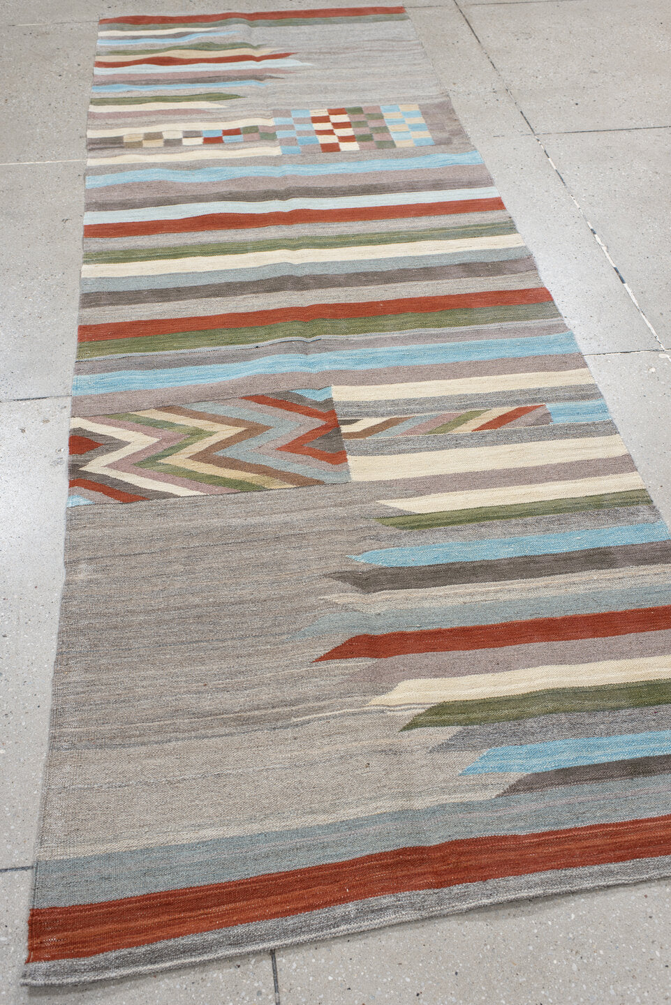 3' x 9' one-of-a-kind handmade vintage Kilim runner rug. Color palette: gray, ivory, rust, pale blue, olive, taupe, charcoal