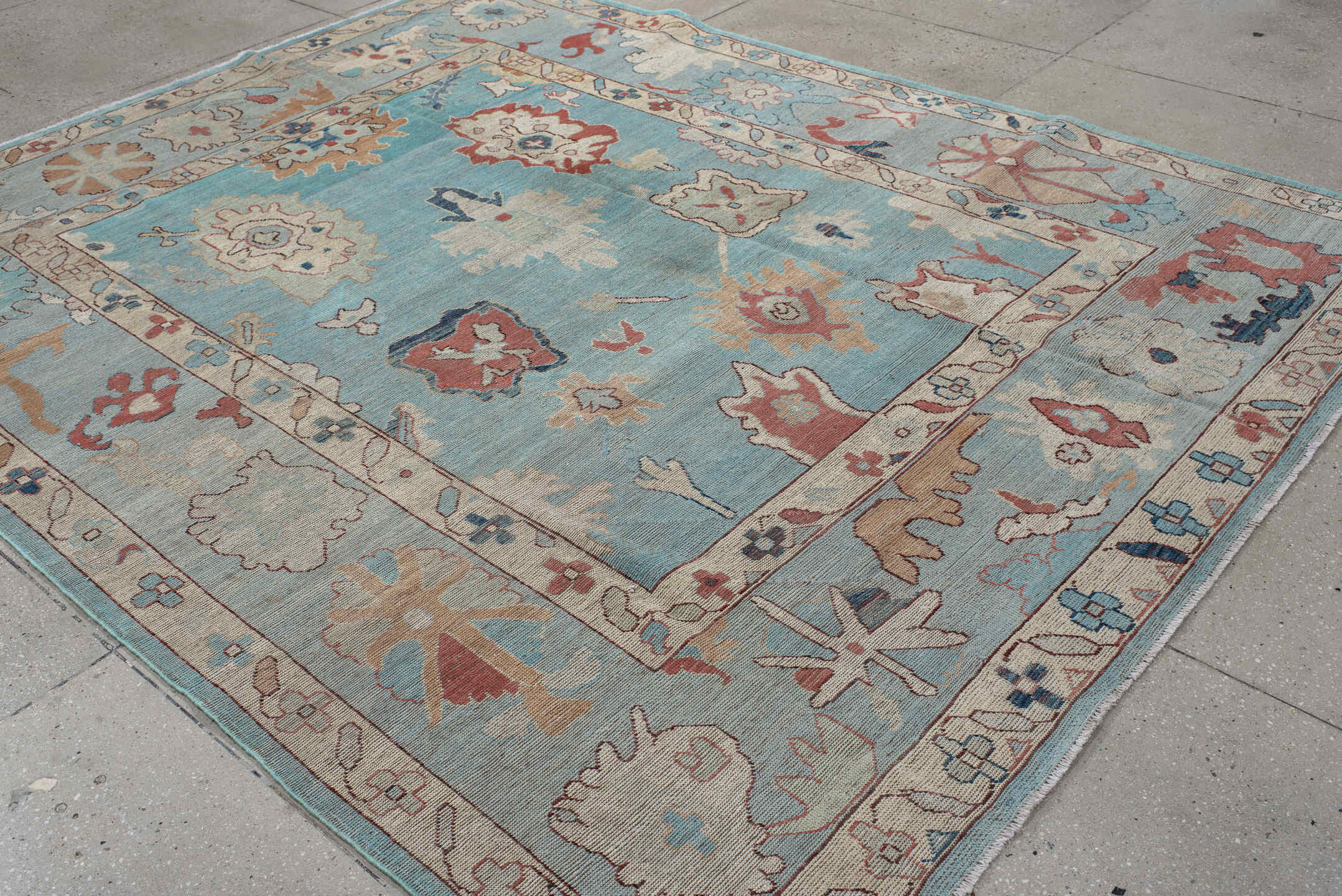 7' x 9' one-of-a-kind handmade vintage Oushak rug. Color palette: sky blue, ivory, pale blue, terra cotta, navy, beige