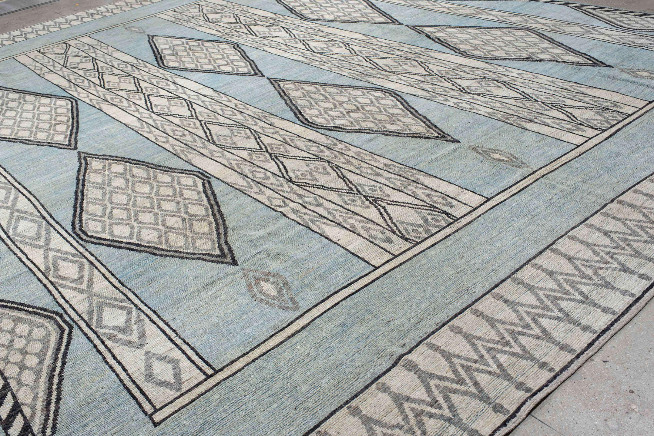 14' x 19' one-of-a-kind handmade vintage Tulu oversize rug. Color palette: pale blue, ivory, charcoal, gray, light blue