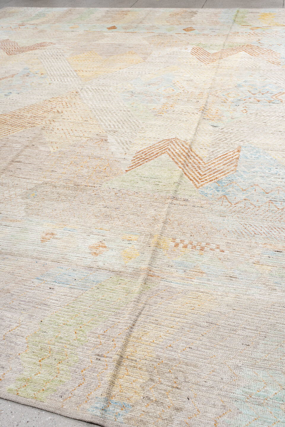 13' x 16' one-of-a-kind handmade vintage Tulu oversize rug. Color palette: ivory, peach, sky_blue, sage, soft_gold, taupe