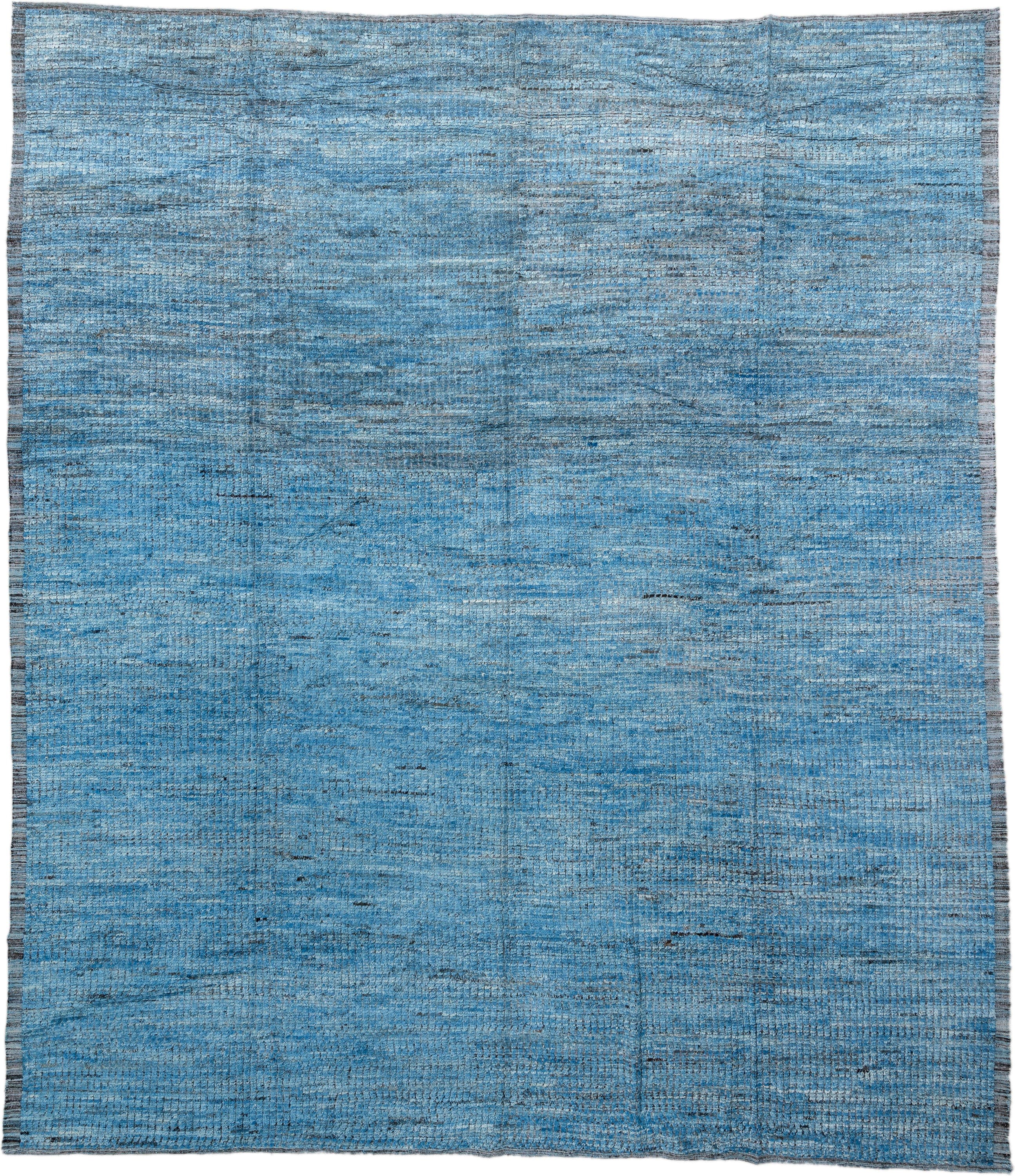 14' x 17' one-of-a-kind handmade vintage Tulu oversize rug. Color palette: sky blue, slate, charcoal, ivory, light blue
