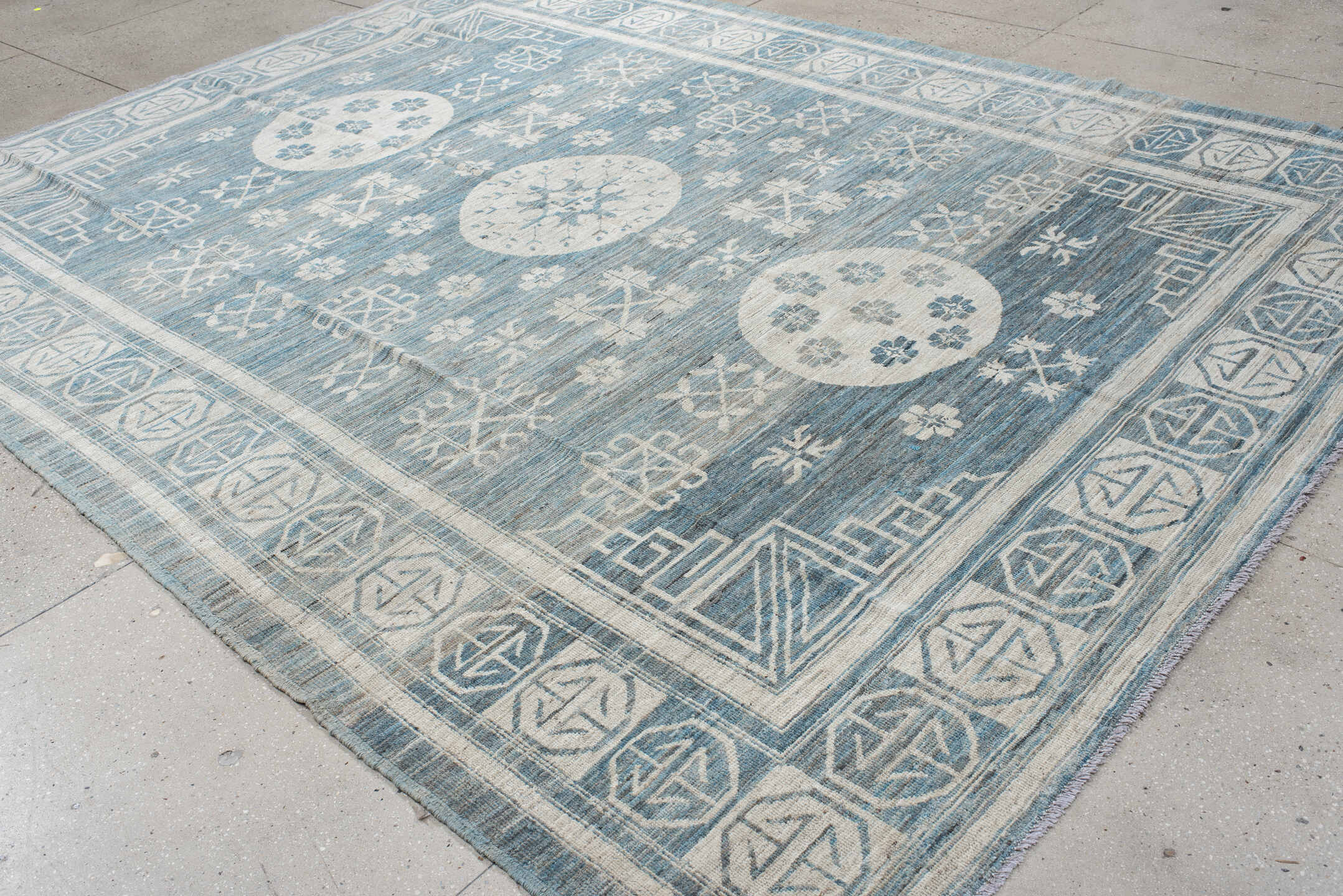 9' x 11' one-of-a-kind handmade vintage Khotan large size rug. Color palette: sky blue, ivory, slate, cream, light blue