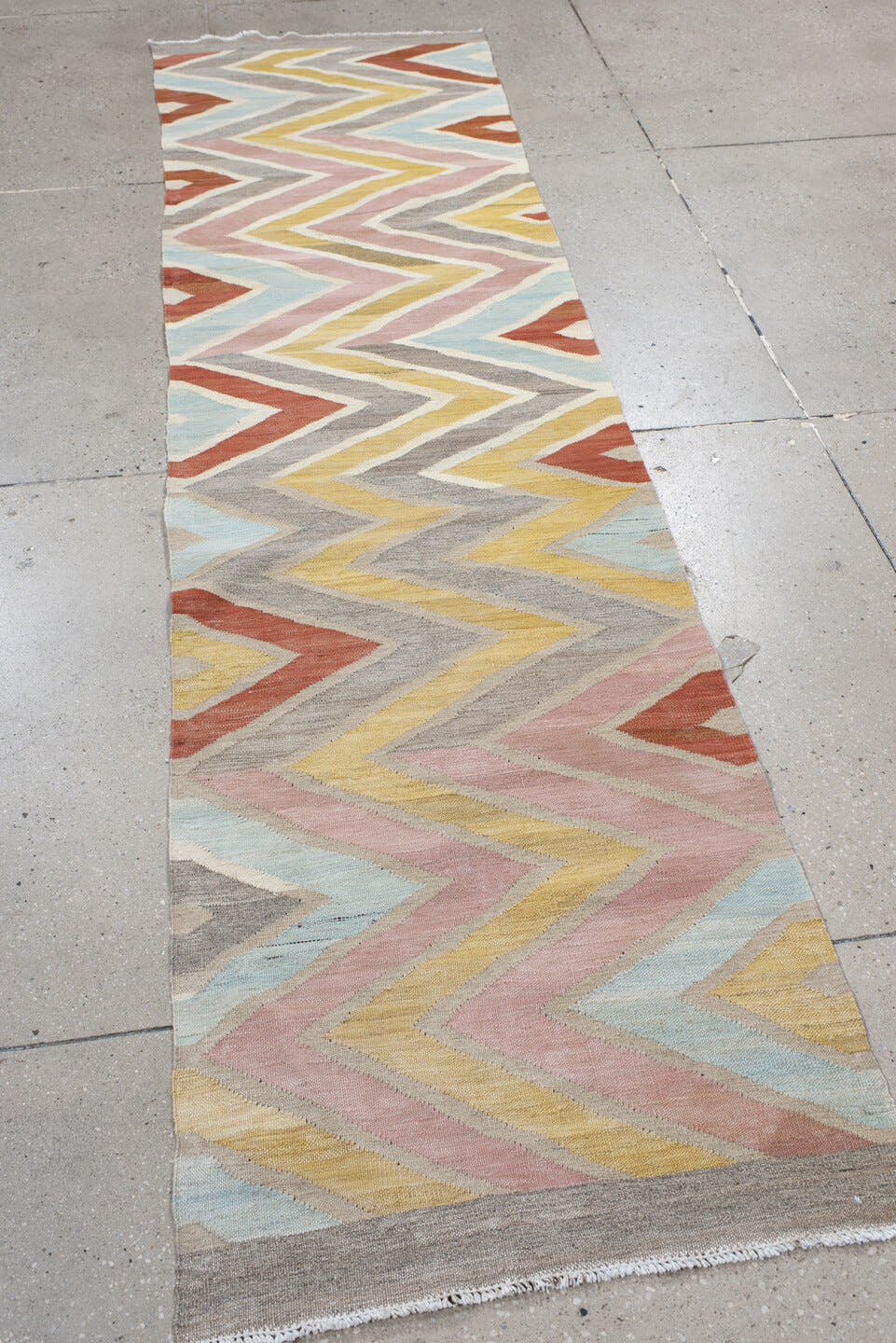 2' x 9' one-of-a-kind handmade vintage Kilim runner rug. Color palette: ivory, gray, blush, pale blue, butter yellow, rust