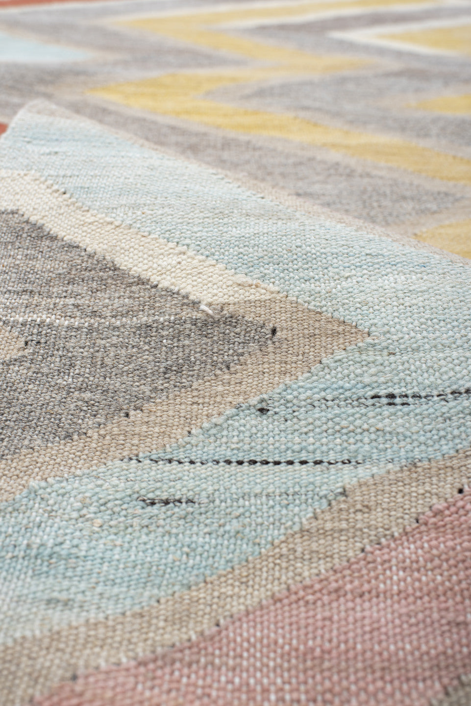 2' x 9' one-of-a-kind handmade vintage Kilim runner rug. Color palette: ivory, gray, blush, pale blue, butter yellow, rust