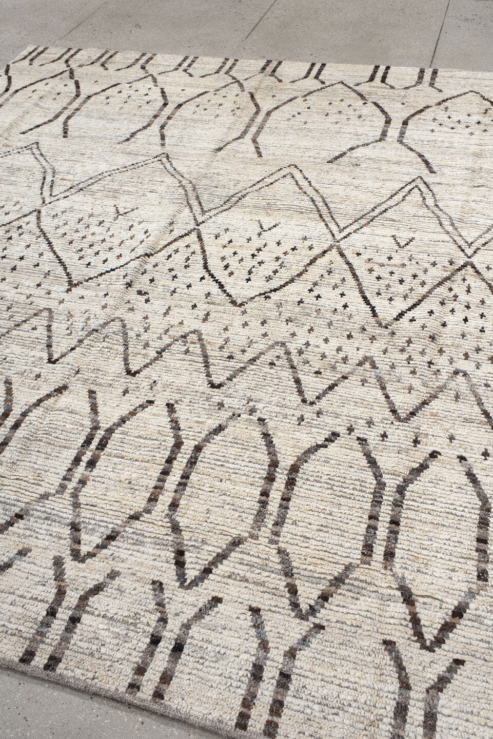 8' x 9' one-of-a-kind handmade vintage Tulu rug. Color palette: ivory, brown, taupe, charcoal, cream, beige, gray, black