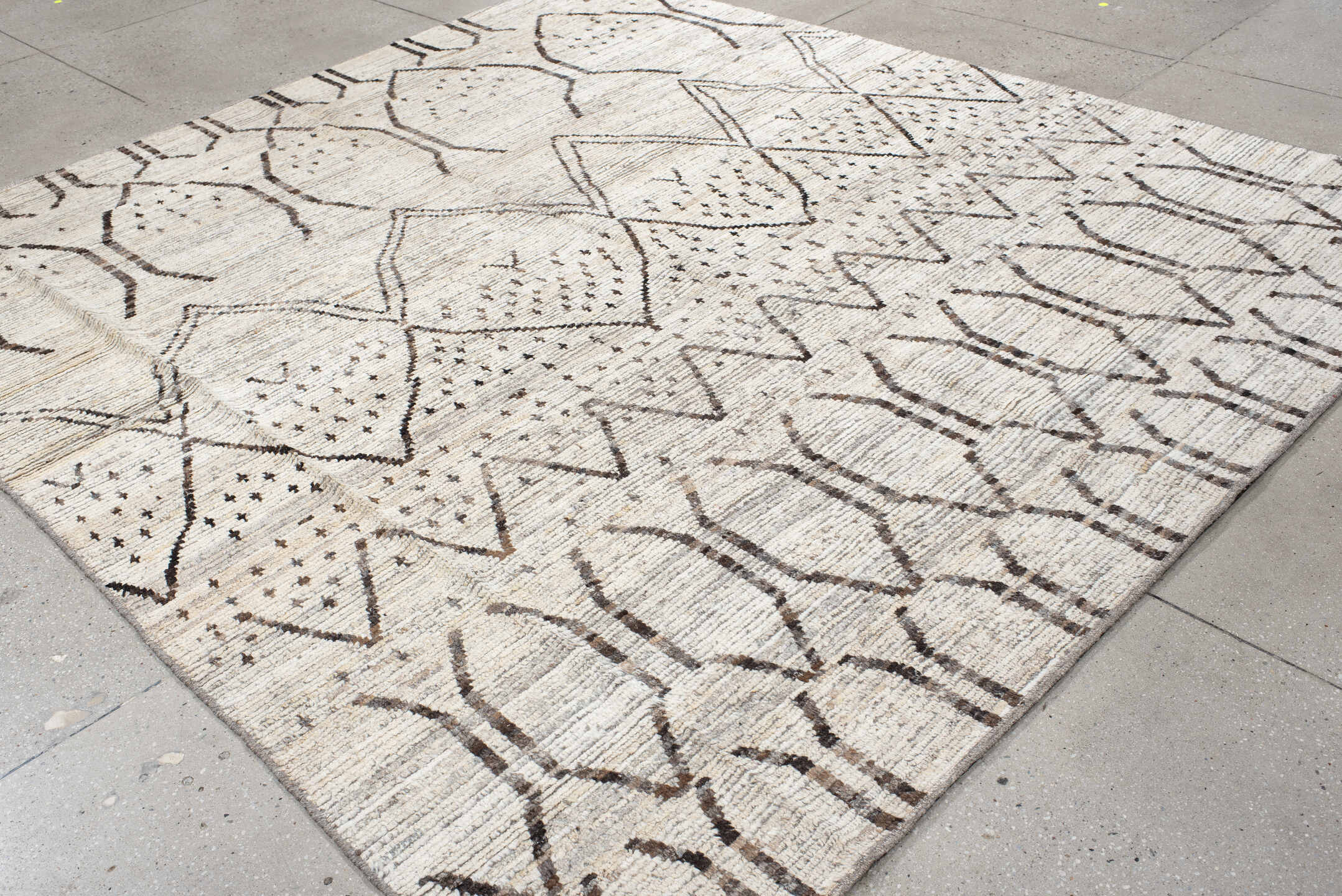 8' x 9' one-of-a-kind handmade vintage Tulu rug. Color palette: ivory, brown, taupe, charcoal, cream, beige, gray, black