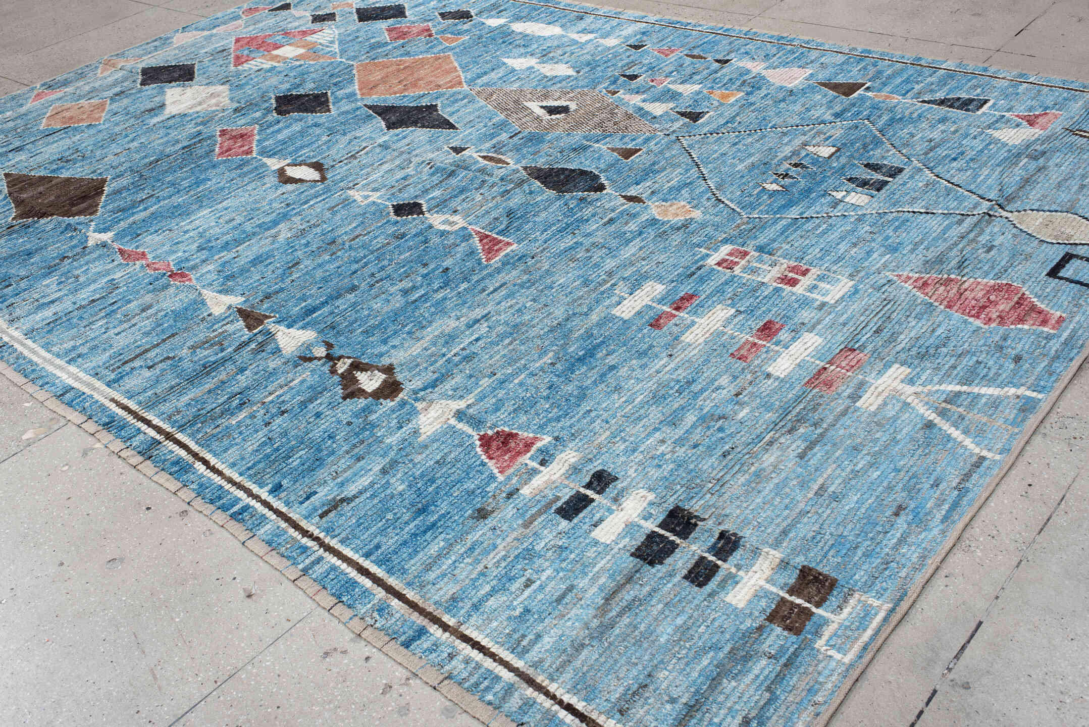 9' x 13' one-of-a-kind handmade vintage Tulu large size rug. Color palette: sky blue, ivory, charcoal, rose, taupe, brown