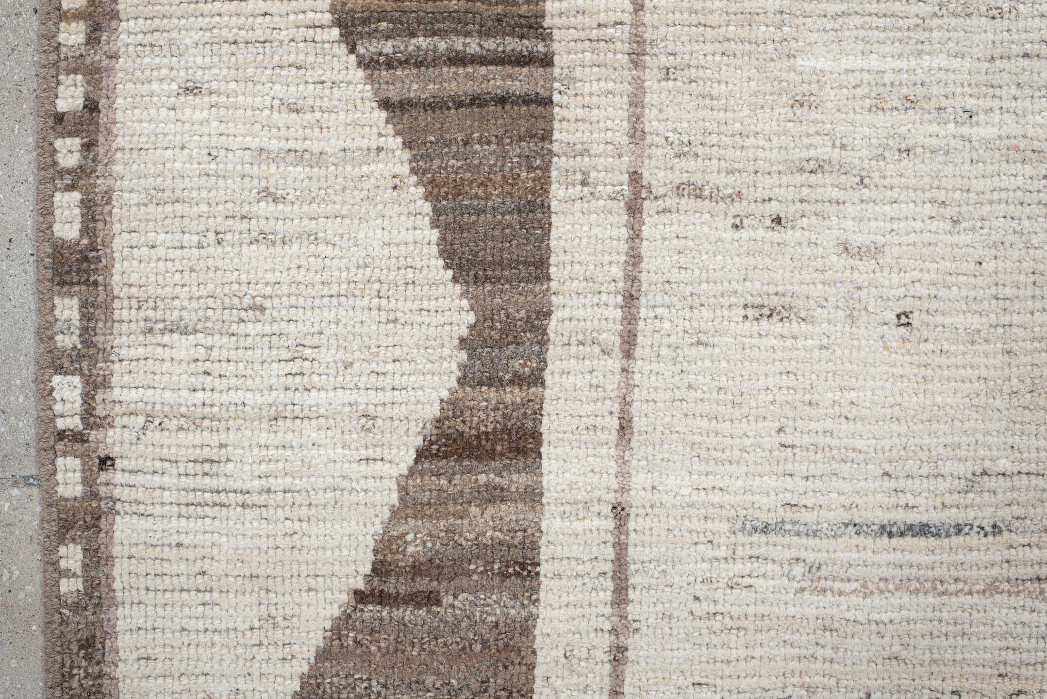 7' x 9' one-of-a-kind handmade vintage Tulu rug. Color palette: ivory, taupe, brown, charcoal, cream, rose, slate, pale blue