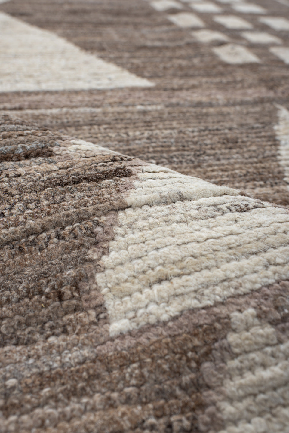 7' x 9' one-of-a-kind handmade vintage Tulu rug. Color palette: ivory, taupe, brown, charcoal, cream, rose, slate, pale blue
