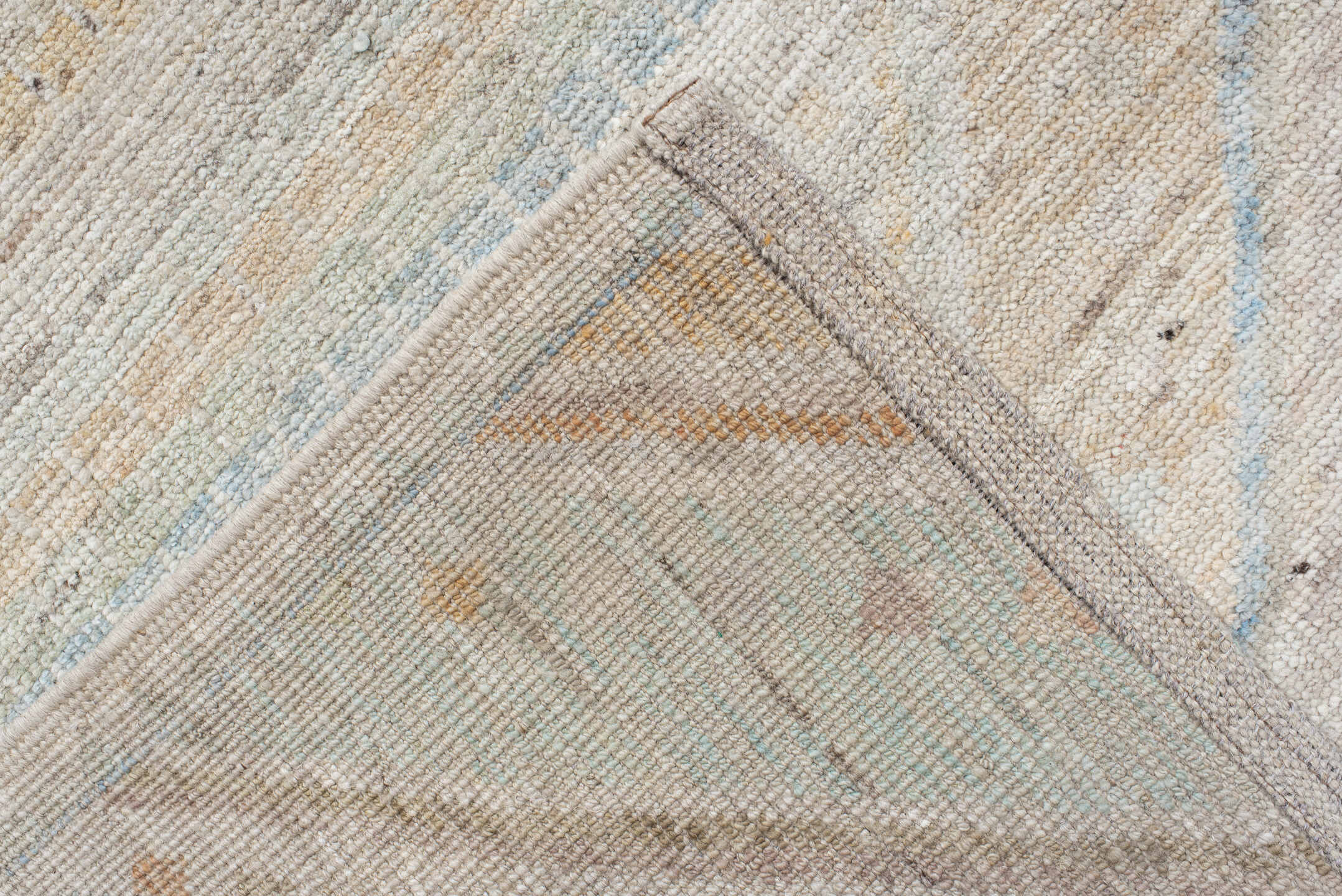 9' x 13' one-of-a-kind handmade vintage Tulu large size rug. Color palette: ivory, pale blue, sand, sage, peach, taupe