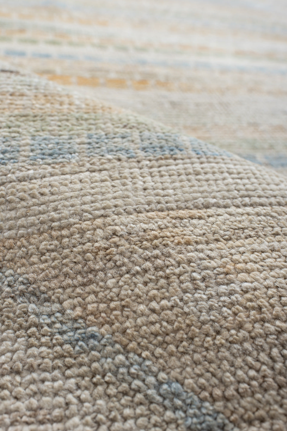 9' x 13' one-of-a-kind handmade vintage Tulu large size rug. Color palette: ivory, pale blue, sand, sage, peach, taupe
