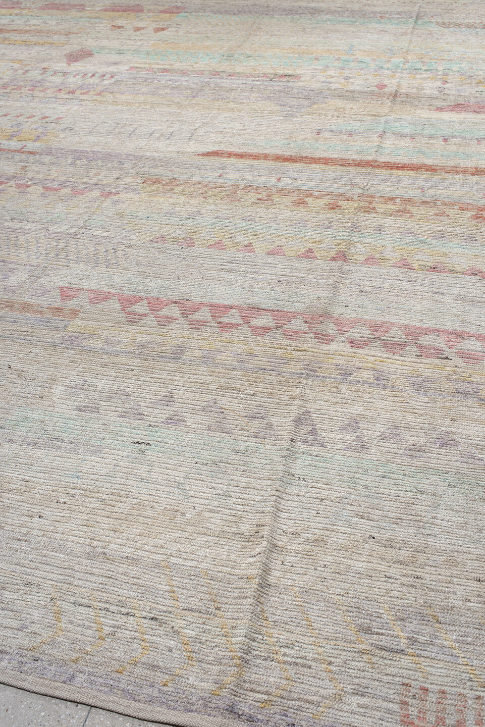 13' x 19' one-of-a-kind handmade vintage Tulu oversize rug. Color palette: ivory, lavender, rose, aqua, pale yellow, coral