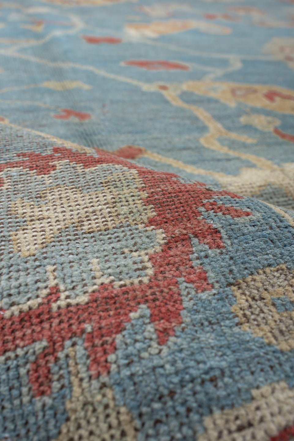 7' x 9' one-of-a-kind handmade vintage Oushak rug. Color palette: red, brown, gray, light blue, light gray, off-white, pink