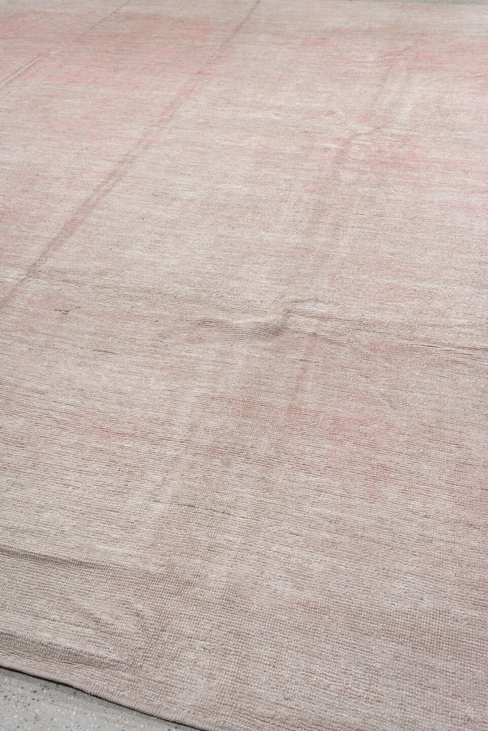11' x 15' one-of-a-kind handmade vintage Tulu oversize rug. Color palette: blush, ivory, rose, taupe, pink, red, beige, gray