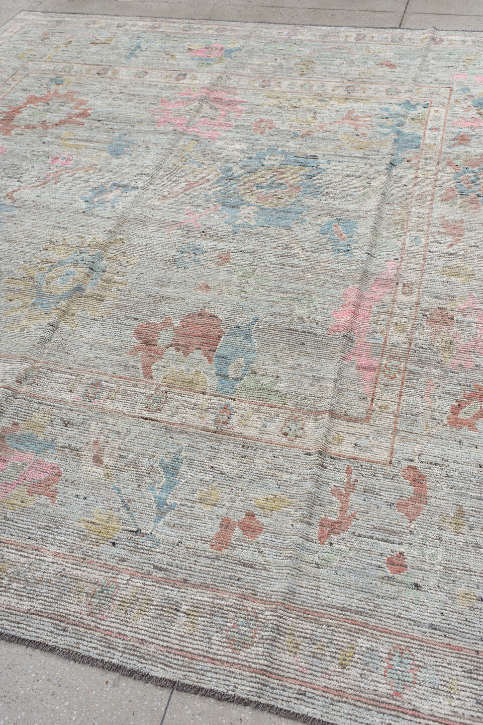 8' x 9' one-of-a-kind handmade vintage Oushak rug. Color palette: ivory, pale blue, blush, taupe, muted gold, terra cotta