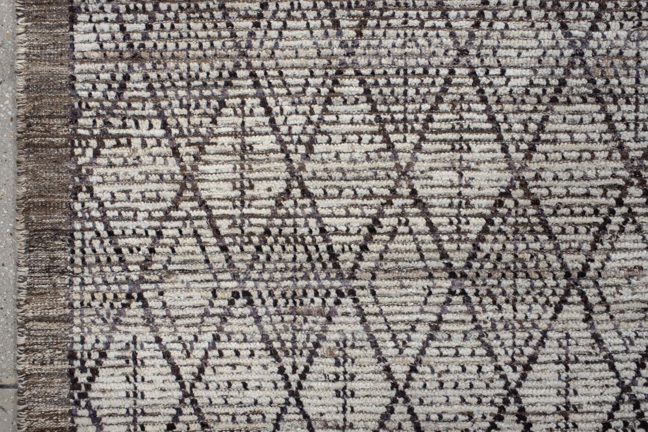 10' x 13' one-of-a-kind handmade vintage Tulu large size rug. Color palette: ivory, charcoal, taupe, brown, gray, black