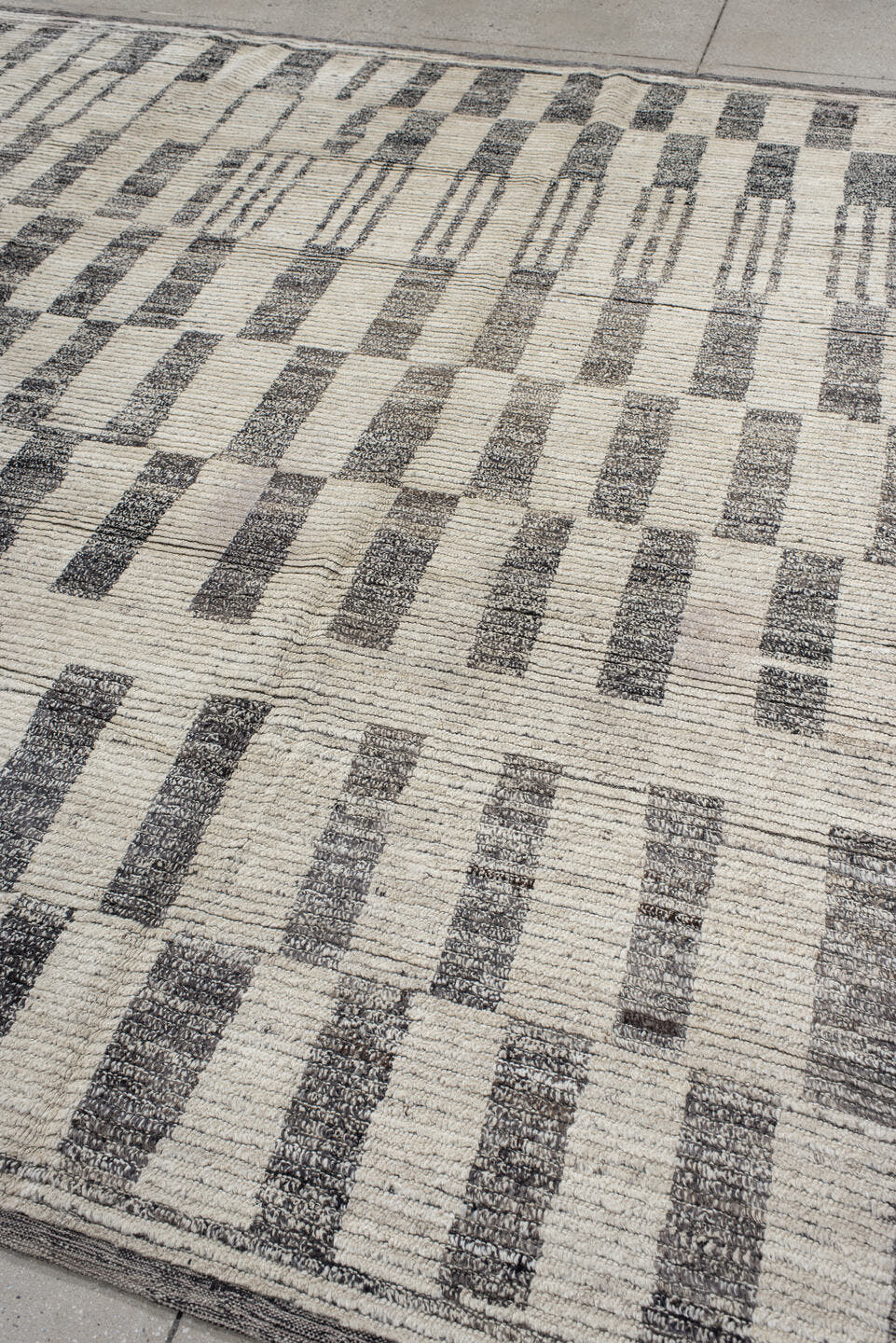 8' x 9' one-of-a-kind handmade vintage Tulu rug. Color palette: ivory, charcoal, gray, black