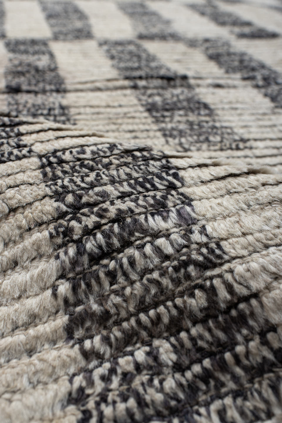 8' x 9' one-of-a-kind handmade vintage Tulu rug. Color palette: ivory, charcoal, gray, black