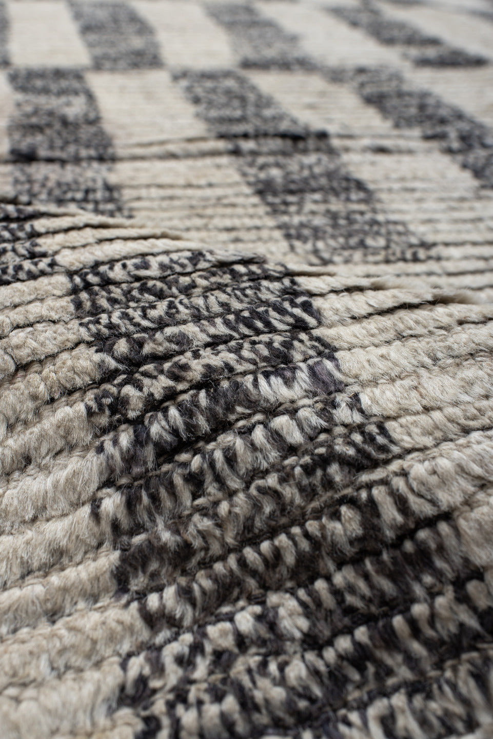 8' x 9' one-of-a-kind handmade vintage Tulu rug. Color palette: ivory, charcoal, gray, black
