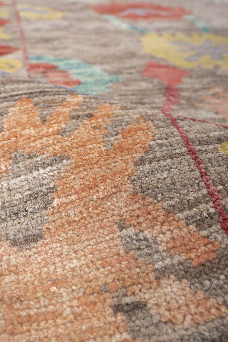 8' x 9' one-of-a-kind handmade vintage Oushak rug. Color palette: red, pink, light gray, off-white, gray, brown, orange