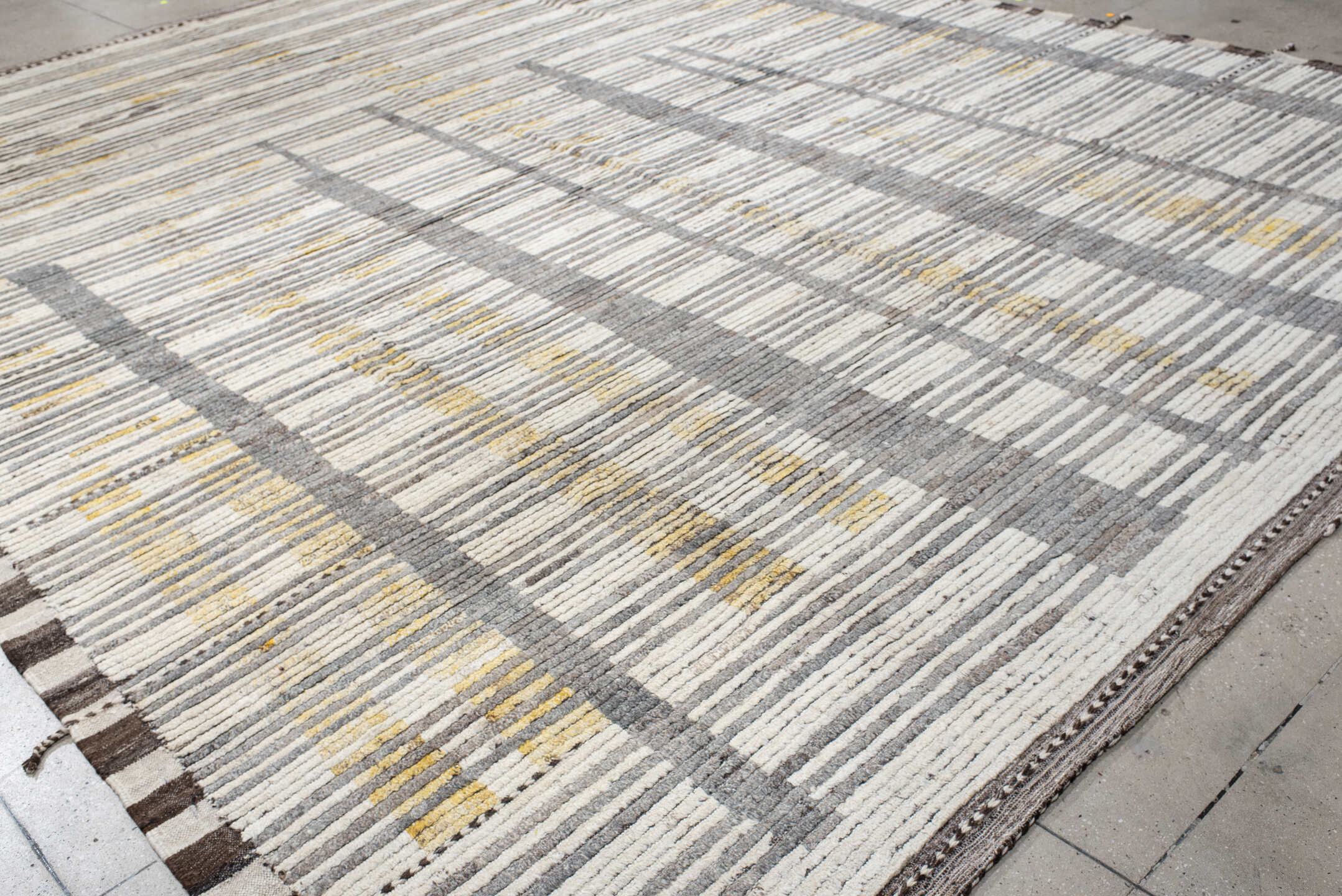 12' x 15' one-of-a-kind handmade vintage Tulu oversize rug. Color palette: ivory, gray, charcoal, gold, taupe, black, beige