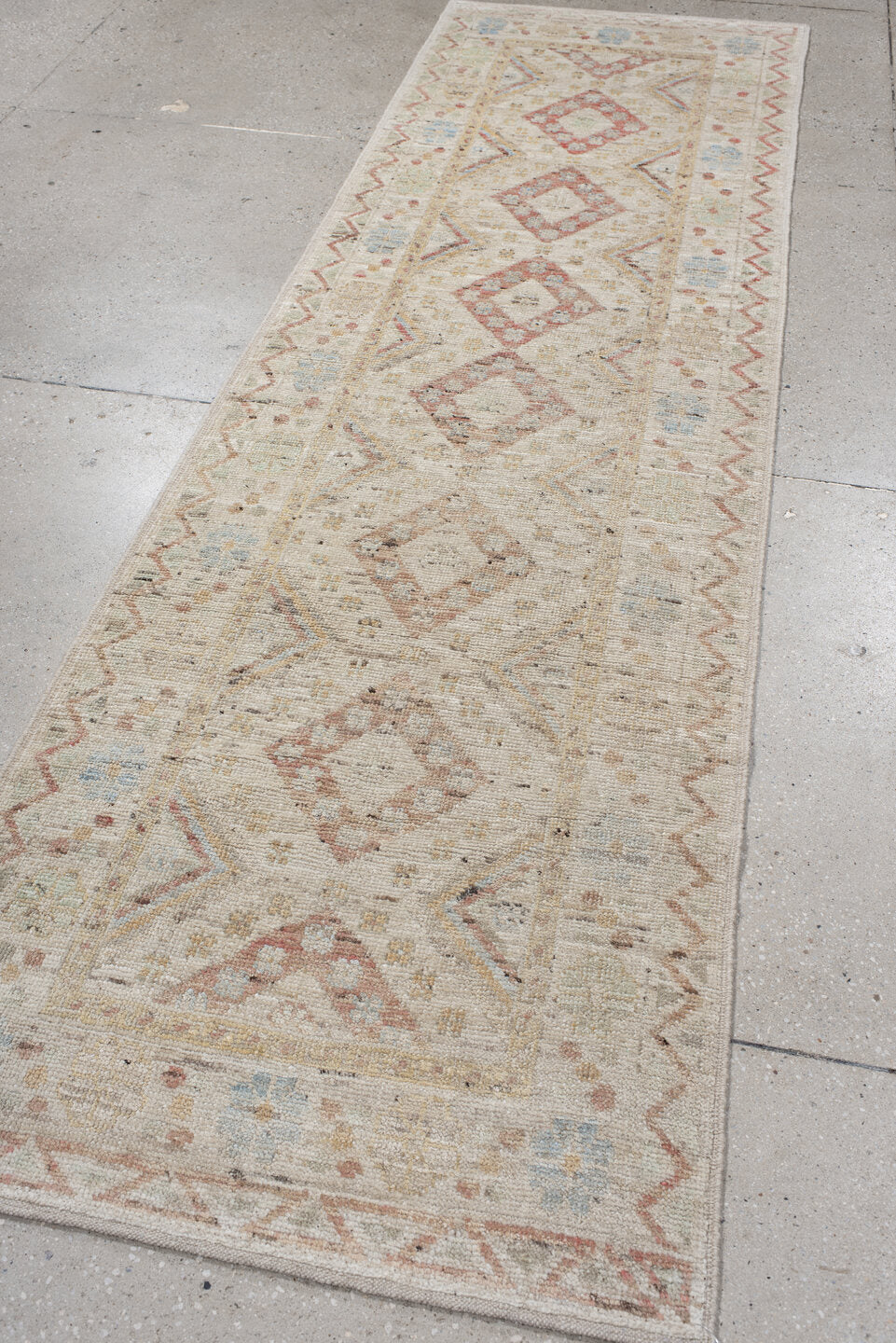 2' x 10' one-of-a-kind handmade vintage Tulu runner rug. Color palette: ivory, blush, pale blue, beige, taupe, sage, camel