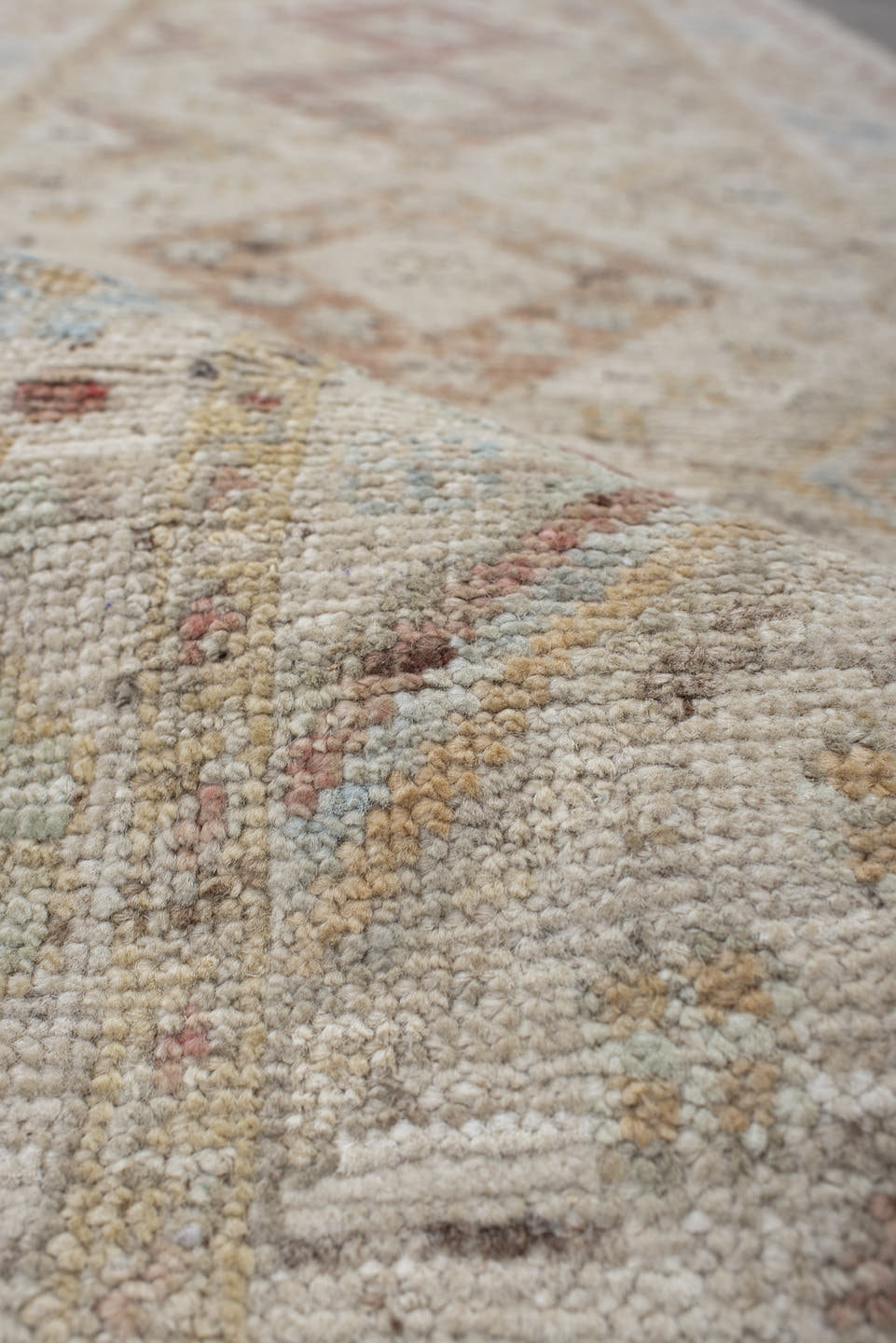 2' x 10' one-of-a-kind handmade vintage Tulu runner rug. Color palette: ivory, blush, pale blue, beige, taupe, sage, camel