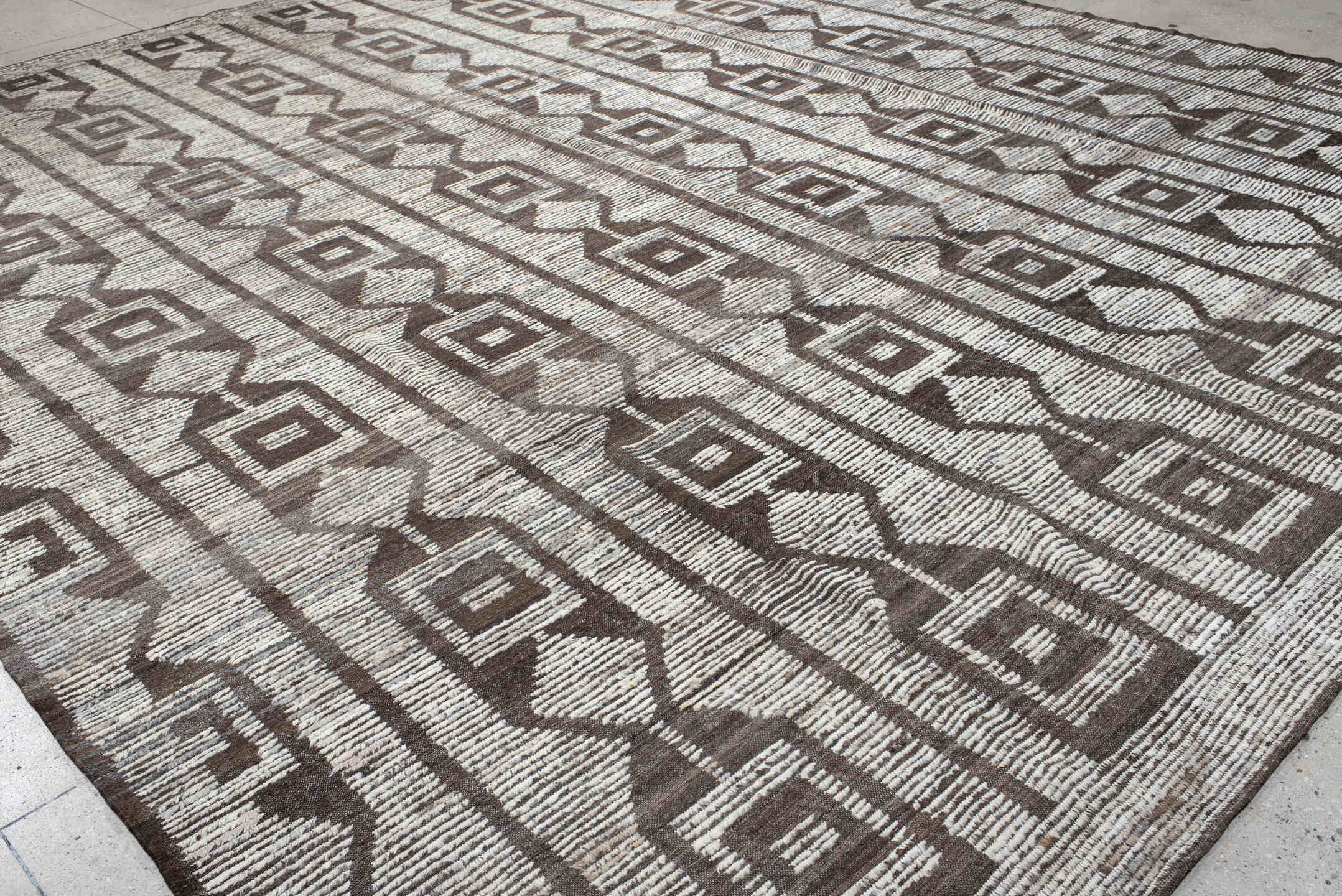 13' x 15' one-of-a-kind handmade vintage Tulu oversize rug. Color palette: ivory, brown, taupe, charcoal, beige, gray, black