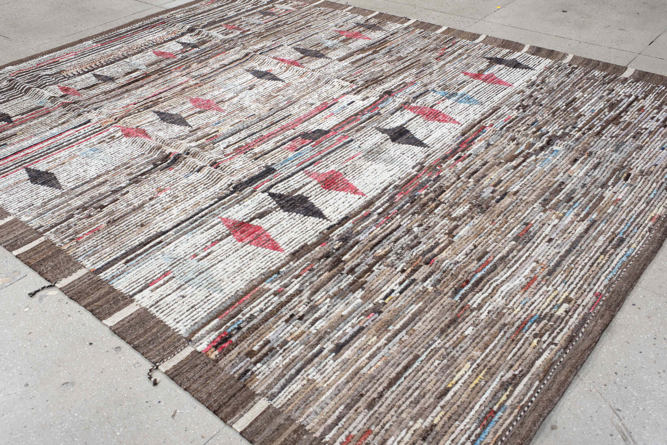 9' x 11' one-of-a-kind handmade vintage Tulu large size rug. Color palette: ivory, brown, charcoal, crimson, sky_blue, taupe