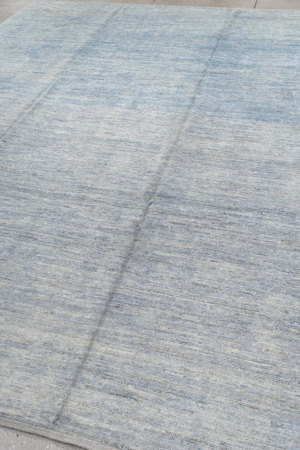9' x 12' one-of-a-kind handmade vintage Tulu large size rug. Color palette: pale blue, ivory, silver, slate, light blue