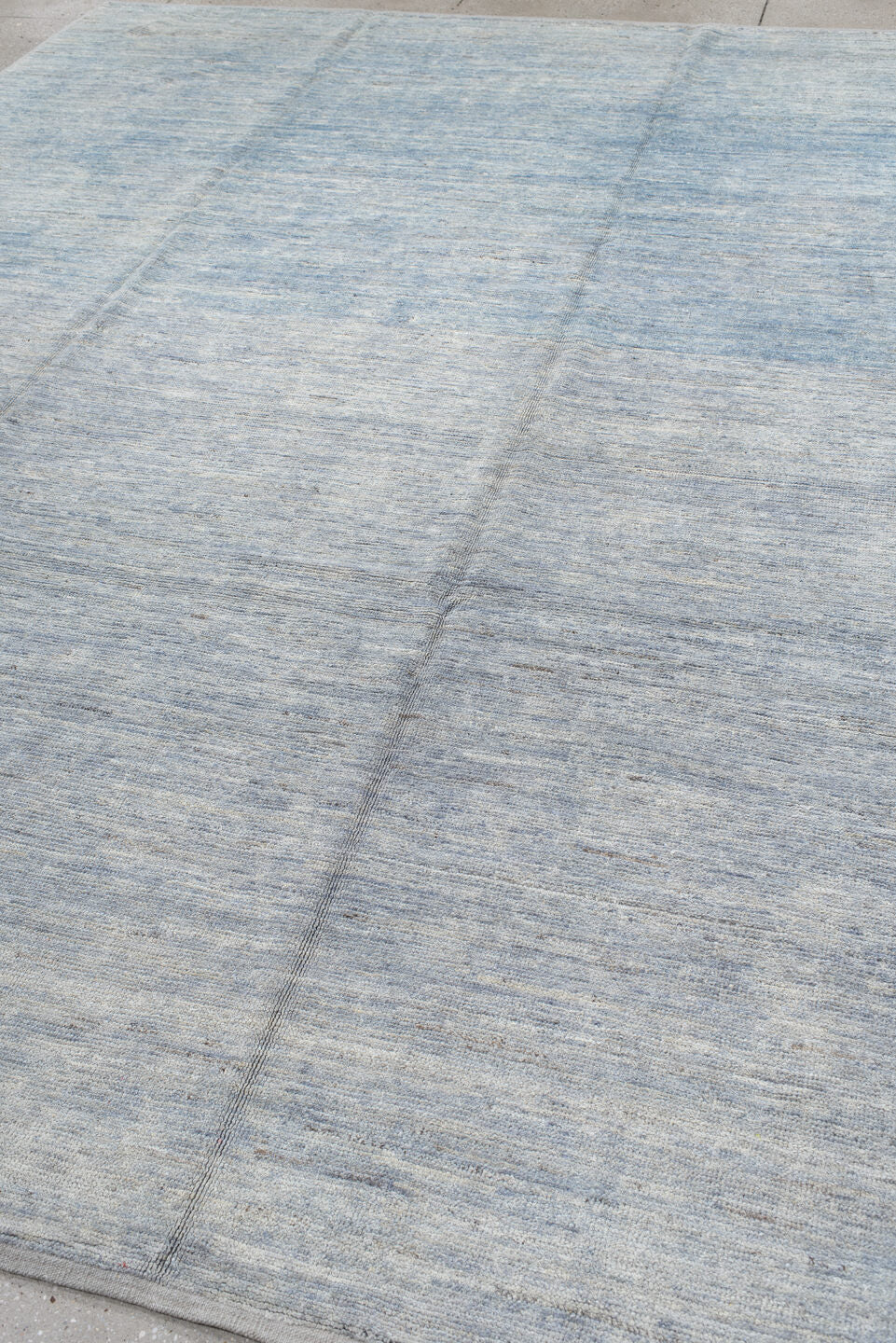 9' x 12' one-of-a-kind handmade vintage Tulu large size rug. Color palette: pale blue, ivory, silver, slate, light blue