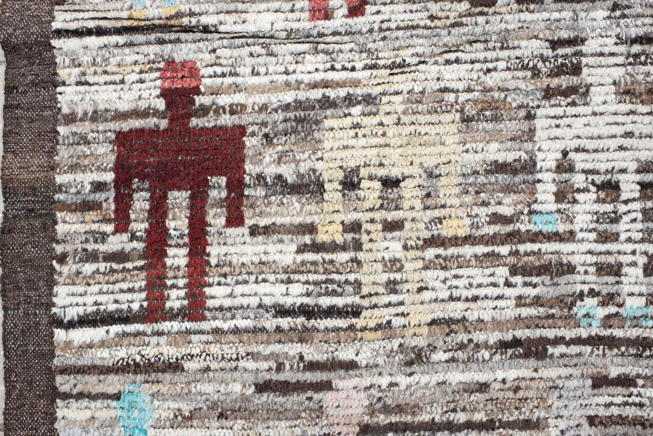 8' x 9' one-of-a-kind handmade vintage Tulu rug. Color palette: ivory, brown, taupe, rust, pale_blue, charcoal, burgundy
