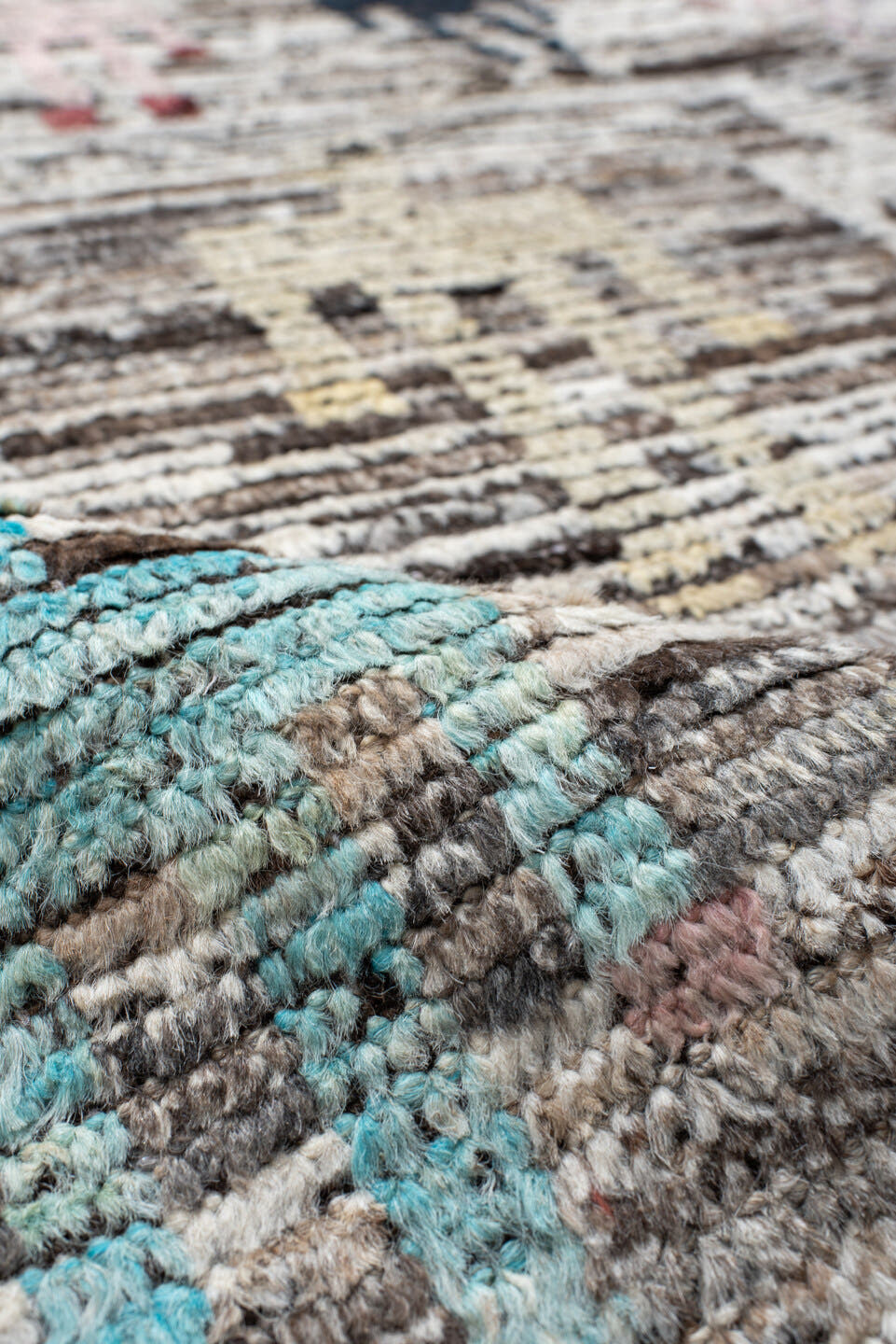 8' x 9' one-of-a-kind handmade vintage Tulu rug. Color palette: ivory, brown, taupe, rust, pale_blue, charcoal, burgundy