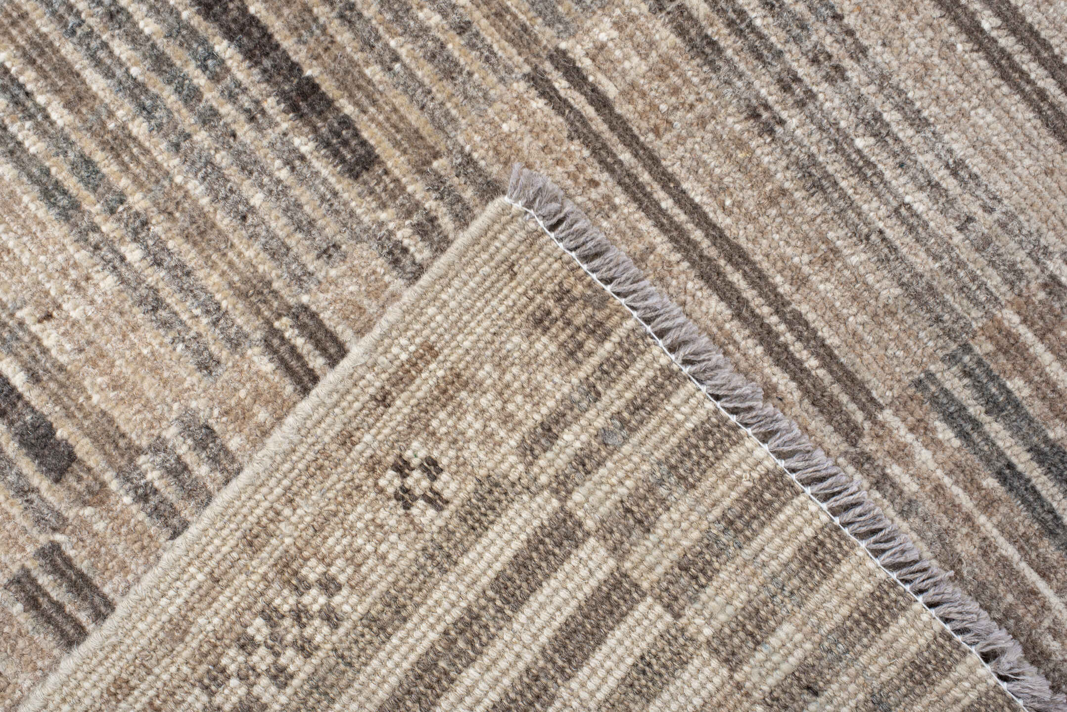 7' x 9' one-of-a-kind handmade vintage Tulu rug. Color palette: ivory, taupe, camel, charcoal, beige, gray, black