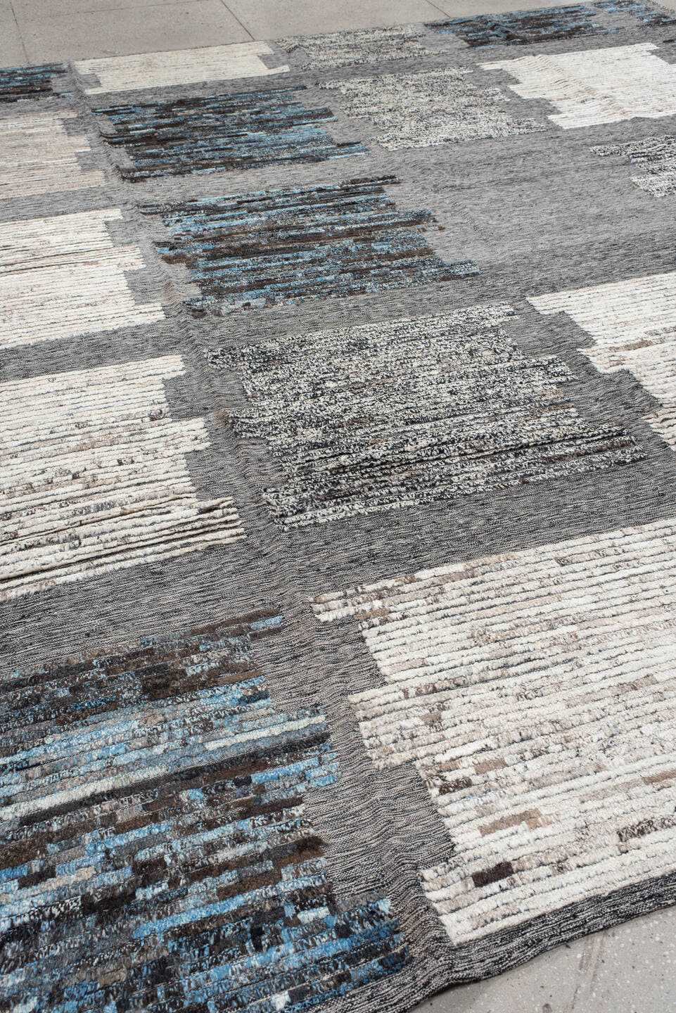 11' x 12' one-of-a-kind handmade vintage Tulu oversize rug. Color palette: gray, ivory, charcoal, sky blue, cream, taupe