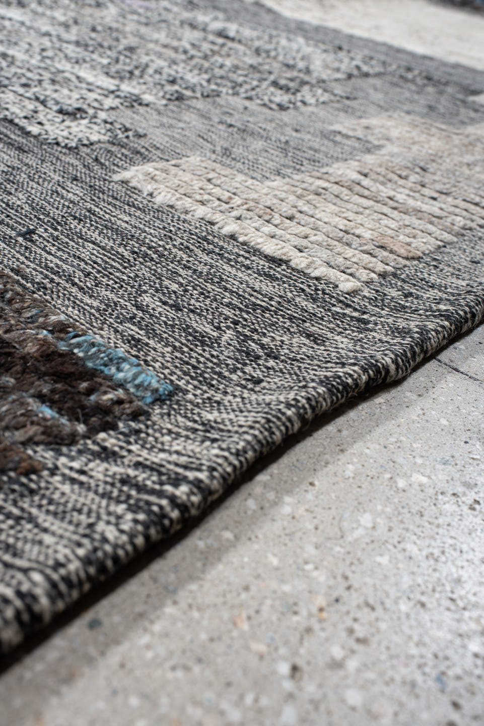11' x 12' one-of-a-kind handmade vintage Tulu oversize rug. Color palette: gray, ivory, charcoal, sky blue, cream, taupe