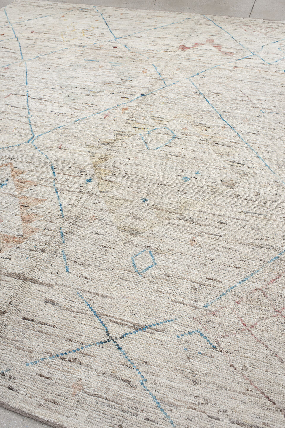 11' x 9' one-of-a-kind handmade vintage Tulu rug. Color palette: ivory, sky_blue, taupe, peach, blush, muted_gold, brown